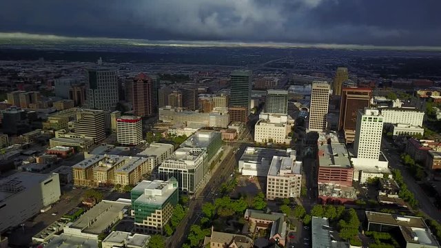 Aerial downtown Salt Lake City Utah sunrise. Drone flight downtown center. Tall skyscraper building and religion area. Early summer mountain valley urban traffic.