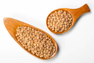 uncooked lentils on white, top view