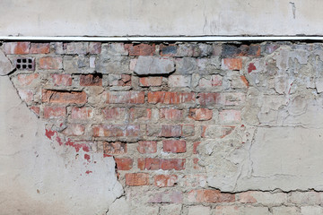 Old plaster and bricks wall