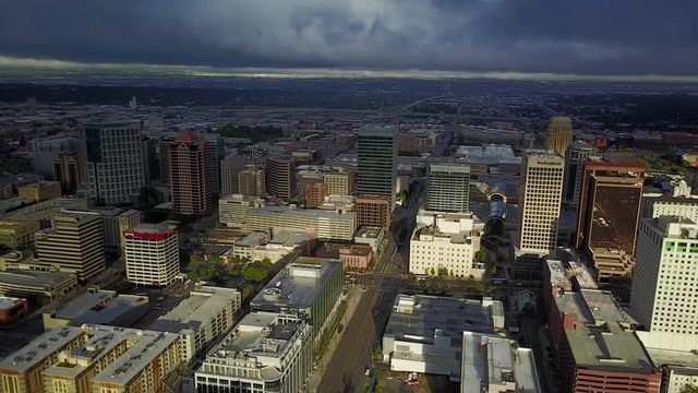 Aerial downtown Salt Lake City Utah sunrise part 2. Drone flight downtown city center. Tall skyscraper building and religion area. Beautiful sunrise glow.