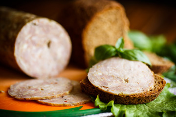 A sandwich with homemade sausage and rye bread