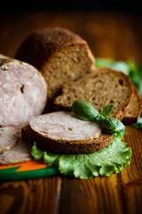 A sandwich with homemade sausage and rye bread