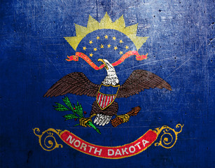 Flag of North Dakota, USA, with an old, vintage metal texture