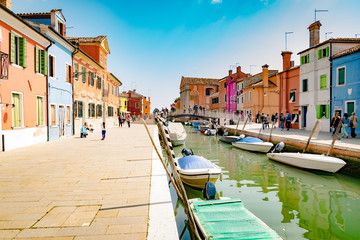 Fototapeta premium Colorful houses by canal in Burano, Venice, Italy.