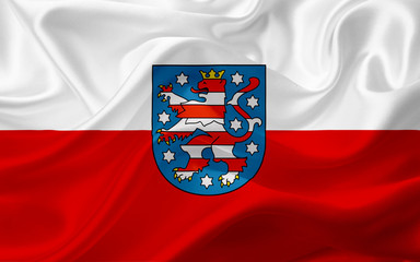 Flag of Thuringia, Germany, with waving fabric texture - obrazy, fototapety, plakaty
