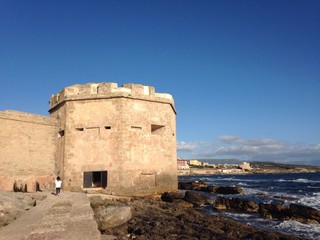 Fototapeta na wymiar coastal tower at alghero, sardinia, italy
