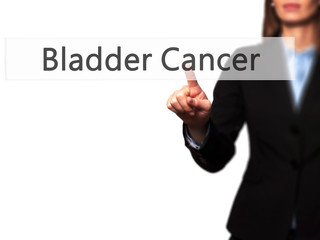 Bladder Cancer -  Young girl working with virtual screen an touching button.