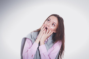 Young woman standing on the white background