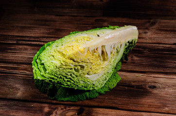 Savoy cabbage on wooden table