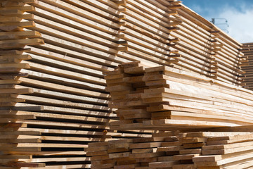 Lumber, boards and timber lie in a pile