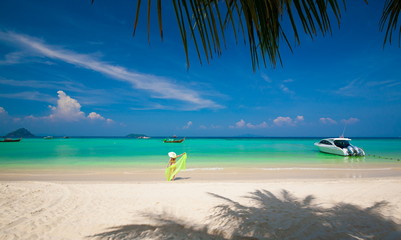 Thailand. Woman sea, bikini, hat, white beach, palm, yacht. Phiphi