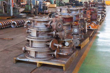 Heap of valve bodies spare parts prapared for mashining in factory.