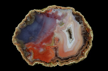 A cross section of the agate stone with quartz geode. Concentric with right and clouded left....