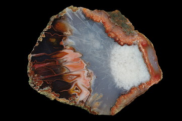 A cross section of the agate stone. Built with many pseudomorphs. Multicolored silica bands colored...