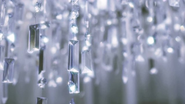 Crystal chandelier. Close up of the crystals. 
Close up shot of a big beautiful crystal luxury chandelier. With bling bling shining reflection.
