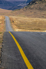 Empty Rural Asphalt Road Running Through Dry Winter Landscape