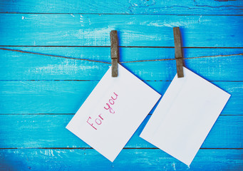 Two envelopes whistling on a rope