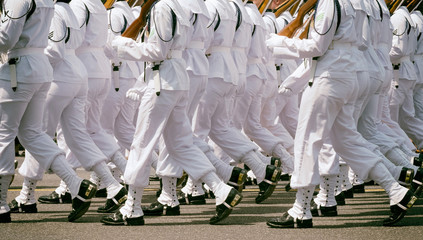 Memorial Day parade. US Navy platoon march in full dress white uniforms. Close up
