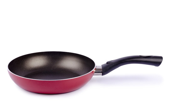 Red frying pan isolated on white