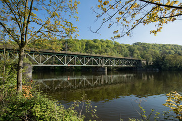 Fototapeta premium Railway Bridge Steel Over The River Ruhr At Essen Kettwig / Kettwiger See
