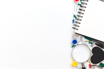 School and office stationery at white table. Flat lay with copy space.