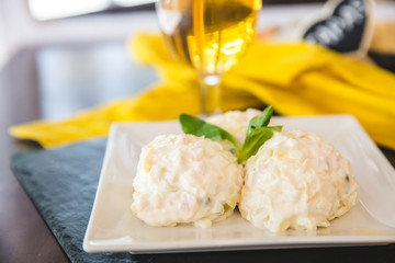  Spanish Tapas. Russian salad in a white plate. Ensaladilla rusa.