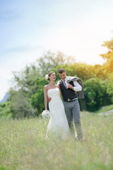 Bride and groom walking in countryside