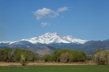 Snow capped Longs Peak and Mt Meeker on a spring or summer day