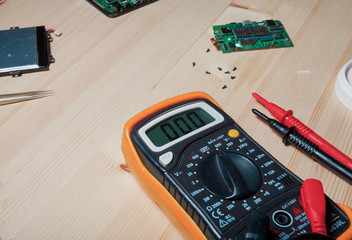 mobile phone repairing in wood table