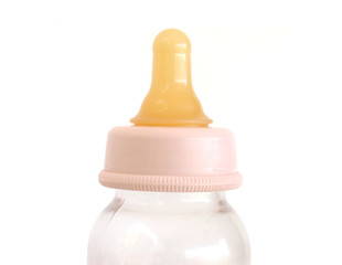 baby's feeding bottle with teat on white background