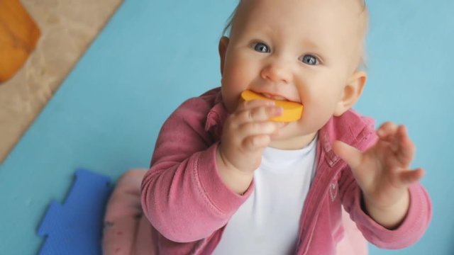 Baby plays with eva puzzle mat