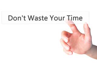 Don't Waste Your Time - Hand pressing a button on blurred background concept on visual screen.