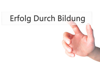 Erfolg Durch Bildung (Success Through Training in German) - Hand pressing a button on blurred background concept on visual screen.