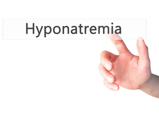 Hyponatremia - Hand pressing a button on blurred background concept on visual screen.