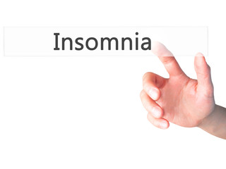 Insomnia - Hand pressing a button on blurred background concept on visual screen.