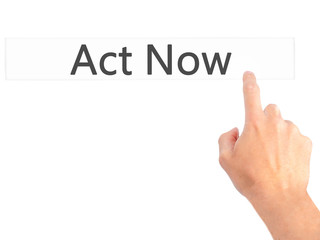 Act Now - Hand pressing a button on blurred background concept on visual screen.