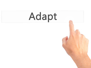 Adapt - Hand pressing a button on blurred background concept on visual screen.