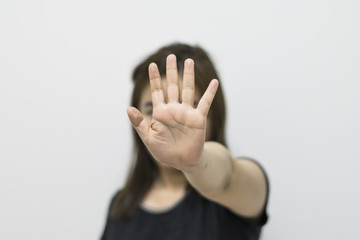 Women make hand in the meaning of stop