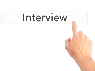 Interview - Hand pressing a button on blurred background concept on visual screen.