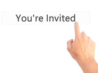 You're Invited! - Hand pressing a button on blurred background concept on visual screen.