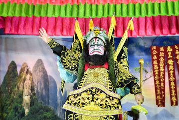 BANGKOK THAILAND - May 2017: China traditional opera actor performs on stage with theatrical costume and facial painting.