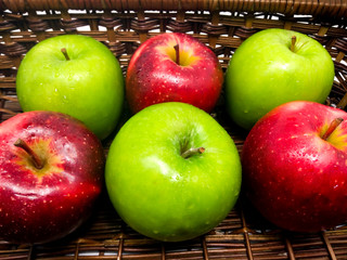 Fresh Green and Red Apples in a Basket
