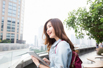 Fototapeta premium Young asian lady travel in city center
