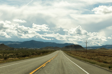 Highway with Clouds and Mountains
