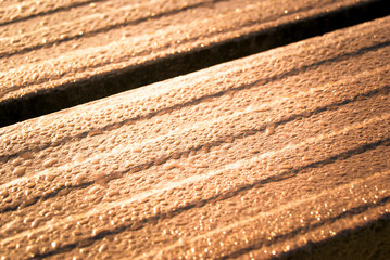 Water drops on a wooden bench