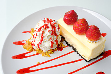 strawberry topping delicious cake with whip cream and strawberry sauce serve on white plate