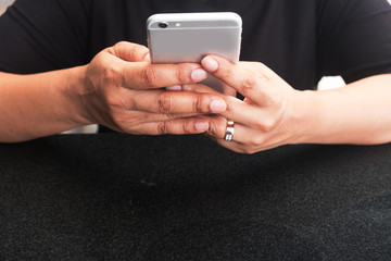 woman holding her smart phone two hand and using it to connecting. concepts for social, business, online shopping, payment, banking, sharing.