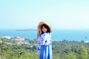 Girl in tie dye indigo dress at Koh Larn island in Pattaya, Thailand