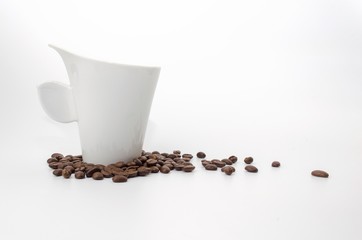 coffee beans and white coffee cup isolated on white background