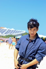 Fototapeta na wymiar boy at the beach at Koh Larn island in Pattaya, Thailand